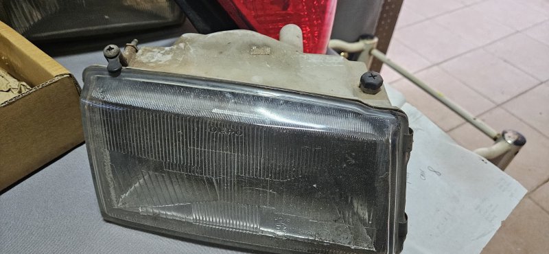 Assorted Vehicle Spares — Flywheel, Headlamps, Taillight & Air Filter