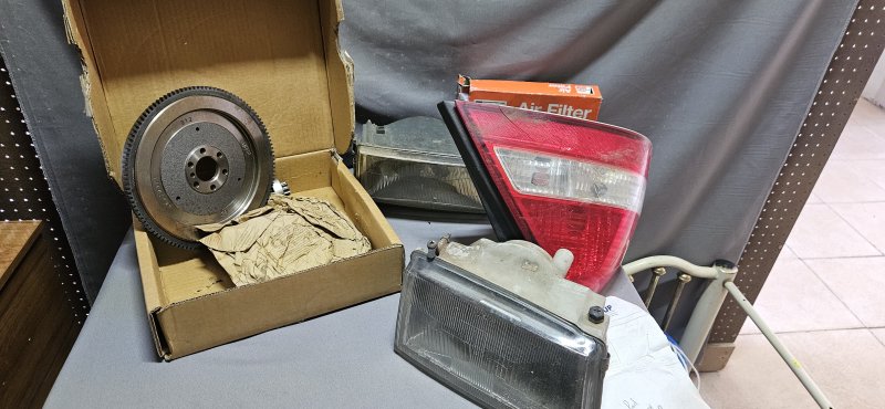 Assorted Vehicle Spares — Flywheel, Headlamps, Taillight & Air Filter