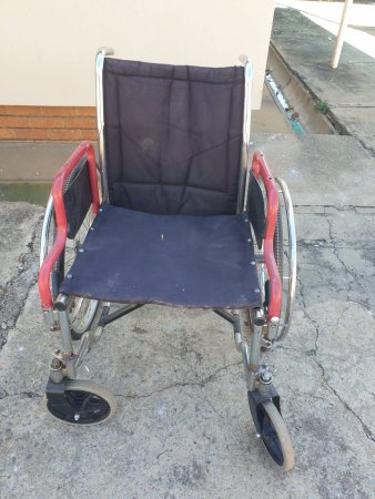Folding Wheelchair — Chrome Frame, Black Upholstery, Red Armrests