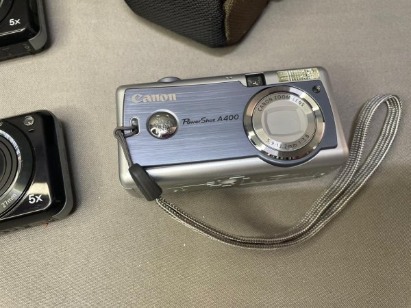 Vintage Digital Cameras ×3 — 2× Samsung + Canon PowerShot A400, with Bags