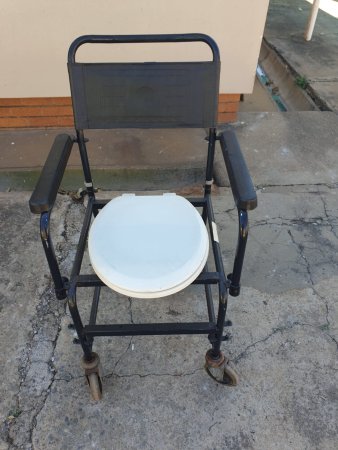 Commode / Shower Chair — Black Steel Frame on Castors, White Seat
